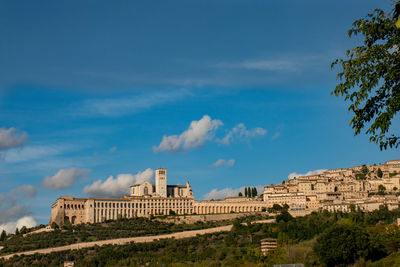 Saint francis basilica in assisi against blue sky