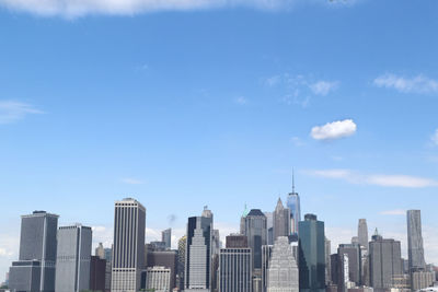 Skyscrapers in city against sky