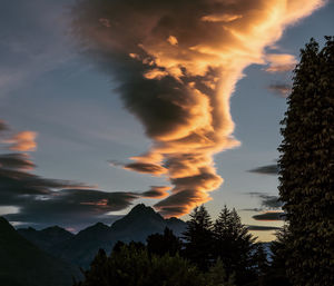 Low angle view of silhouette mountains against sky during sunset