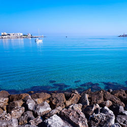 Scenic view of sea against blue sky