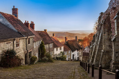 View of old buildings against sky