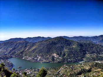 Scenic view of mountains against clear blue sky
