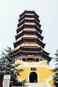 Low angle view of pagoda against sky