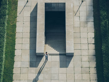 High angle view of man standing by steps