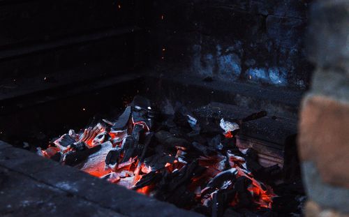 High angle view of fire on log at night