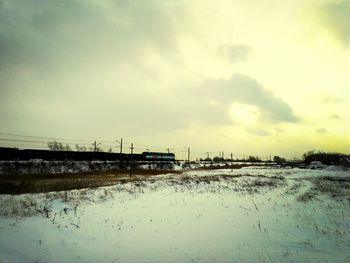 Scenic view of landscape against cloudy sky
