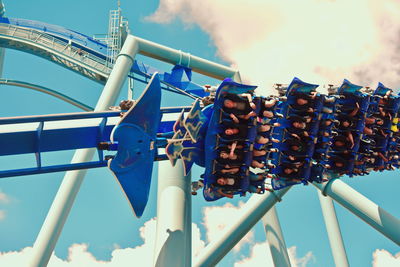 Low angle view of amusement park ride against sky