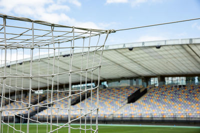 Low angle view of soccer field against sky