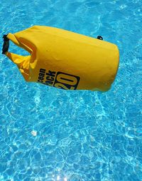 Yellow floating on swimming pool