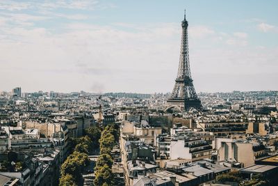 Eiffel tower and buildings against sky