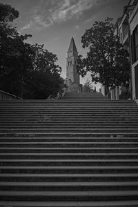 Low angle view of staircase by building against sky