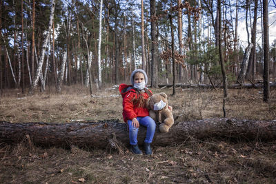 Full length of friends enjoying in forest