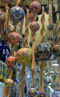 Close-up of decorations hanging for sale at market stall