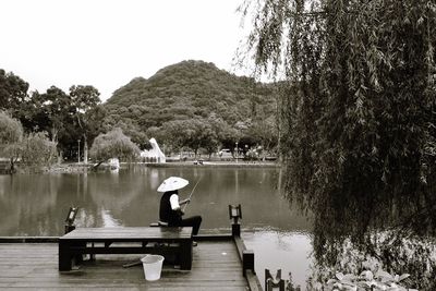 Scenic view of lake with mountains in background