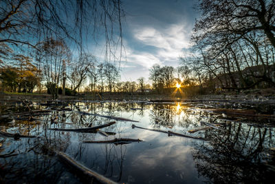 Scenic view of lake against sky during sunset