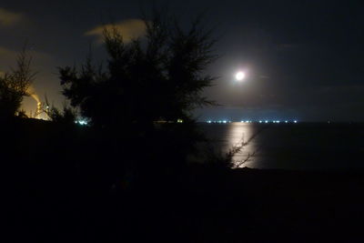 Scenic view of landscape against sky at night