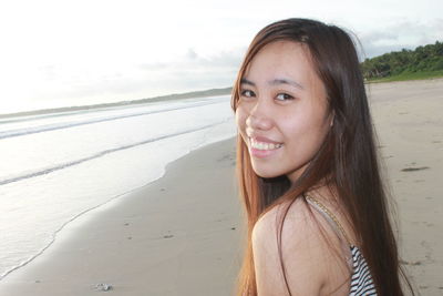 Portrait of young woman on beach