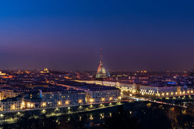 Illuminated buildings in city at night