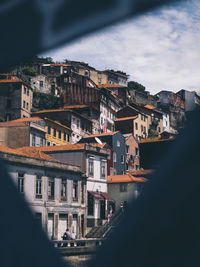 High angle view of buildings in town against sky