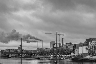 Factory against sky in city