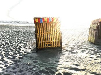 Lifeguard hut on beach against clear sky