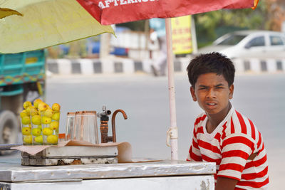 Boy at street market stall