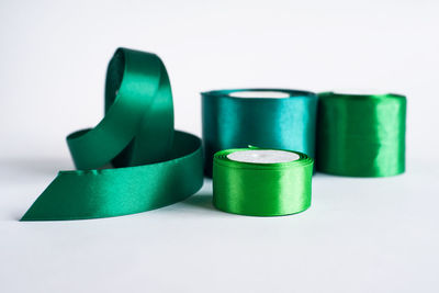 Close-up of colored pencils over white background