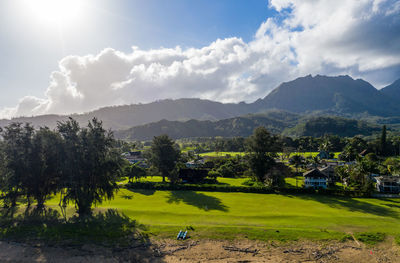 Aerial panoramic image at sunrise overlooking the houses in hanalei from waioli beach park on kauai