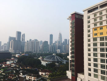 High angle view of buildings in city against clear sky