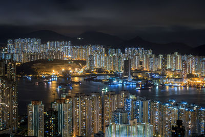 Illuminated city at waterfront