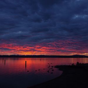 Scenic view of sea against dramatic sky