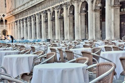 Empty chairs and tables in restaurant