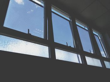 Low angle view of sky seen through window