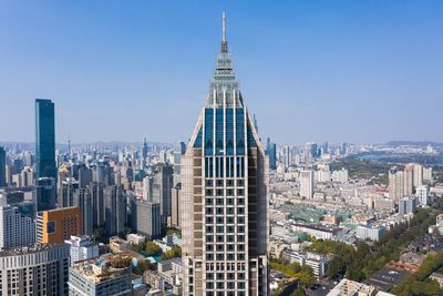 Modern buildings in city against clear sky