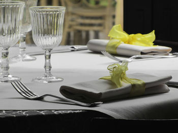 Close-up of place setting on dining table