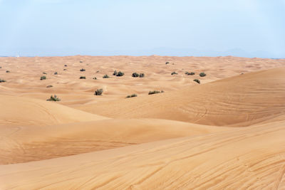 Scenic view of desert against clear sky