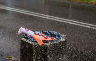 Close-up of child on playground, doll in a dumb