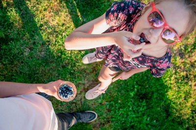 High angle view of friends on grass