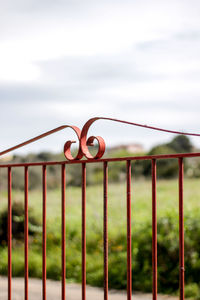 Fence on field against sky