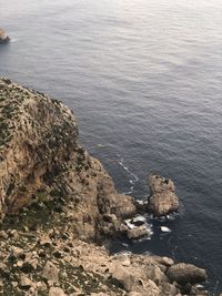 High angle view of rock formation in sea