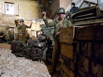 Men in front of built structure