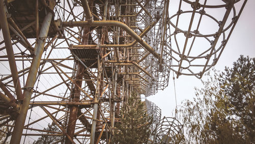 Low angle view of abandoned construction site against sky