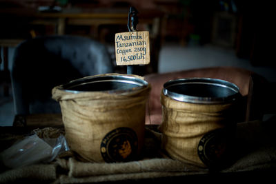 Close-up of containers with label on table