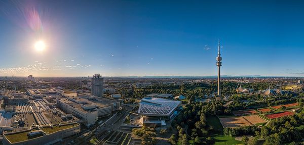 High angle view of cityscape against blue sky