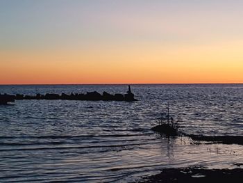 Scenic view of sea against sky during sunset