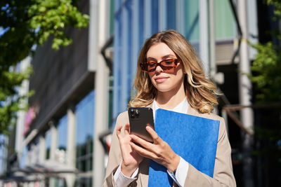 Young woman using mobile phone