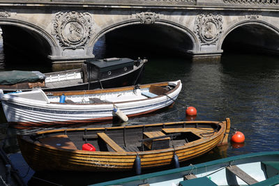 Boats moored at harbor