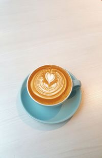 Close-up of cappuccino on table