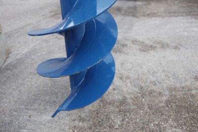 Close-up of blue umbrella on beach