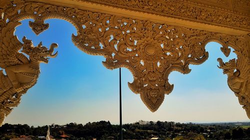 Low angle view of ornate building against clear sky